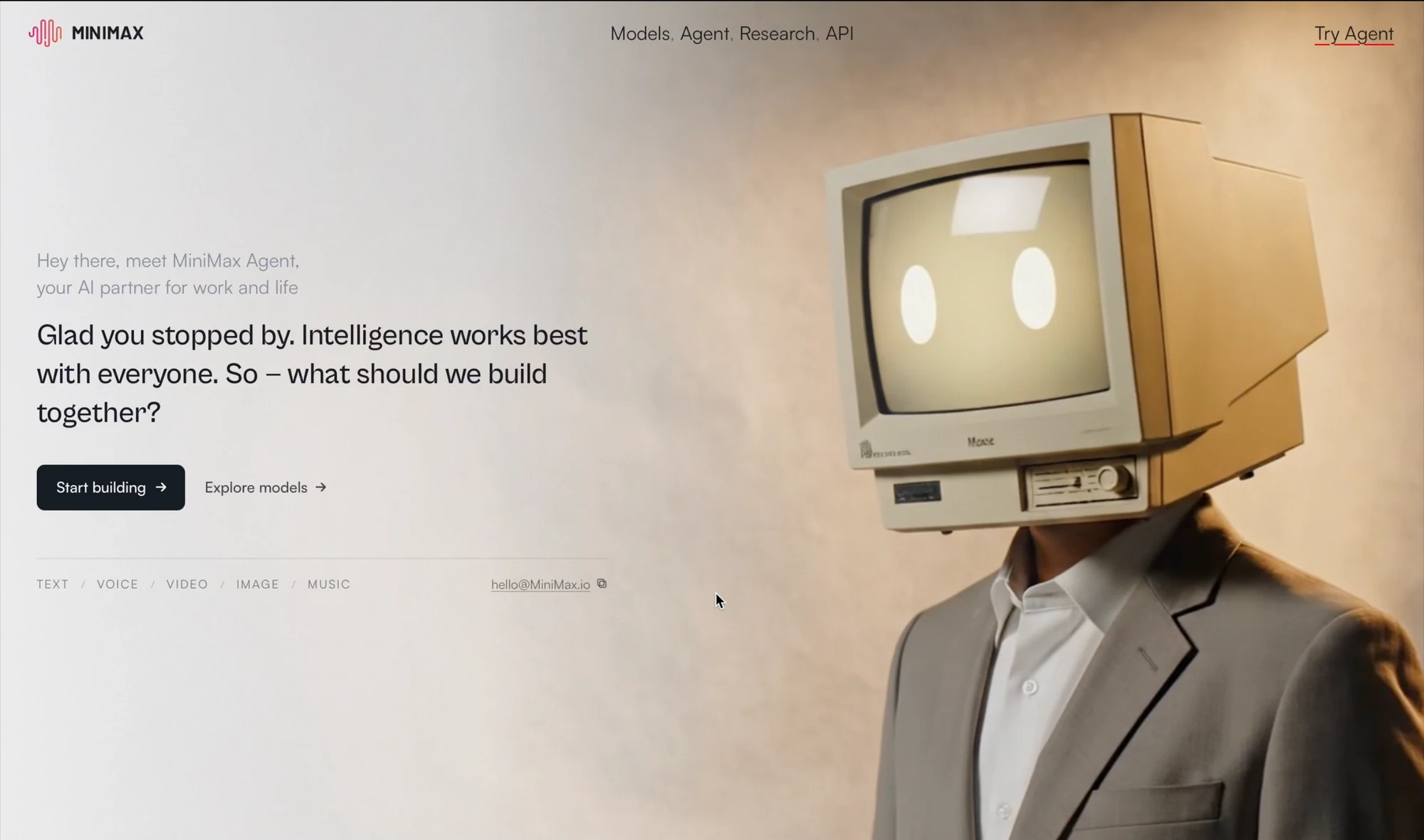 MiniMax technology company website with a warm background and a retro-monitor character.